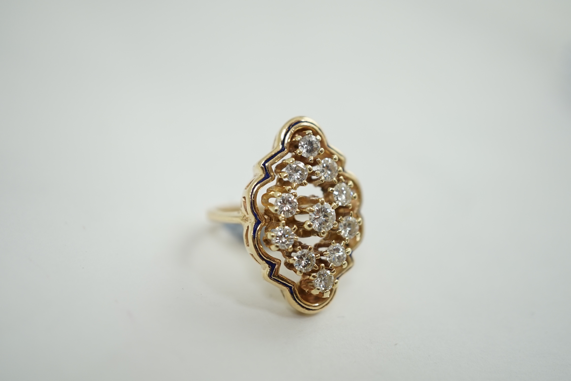 A modern gold and diamond cluster set ring